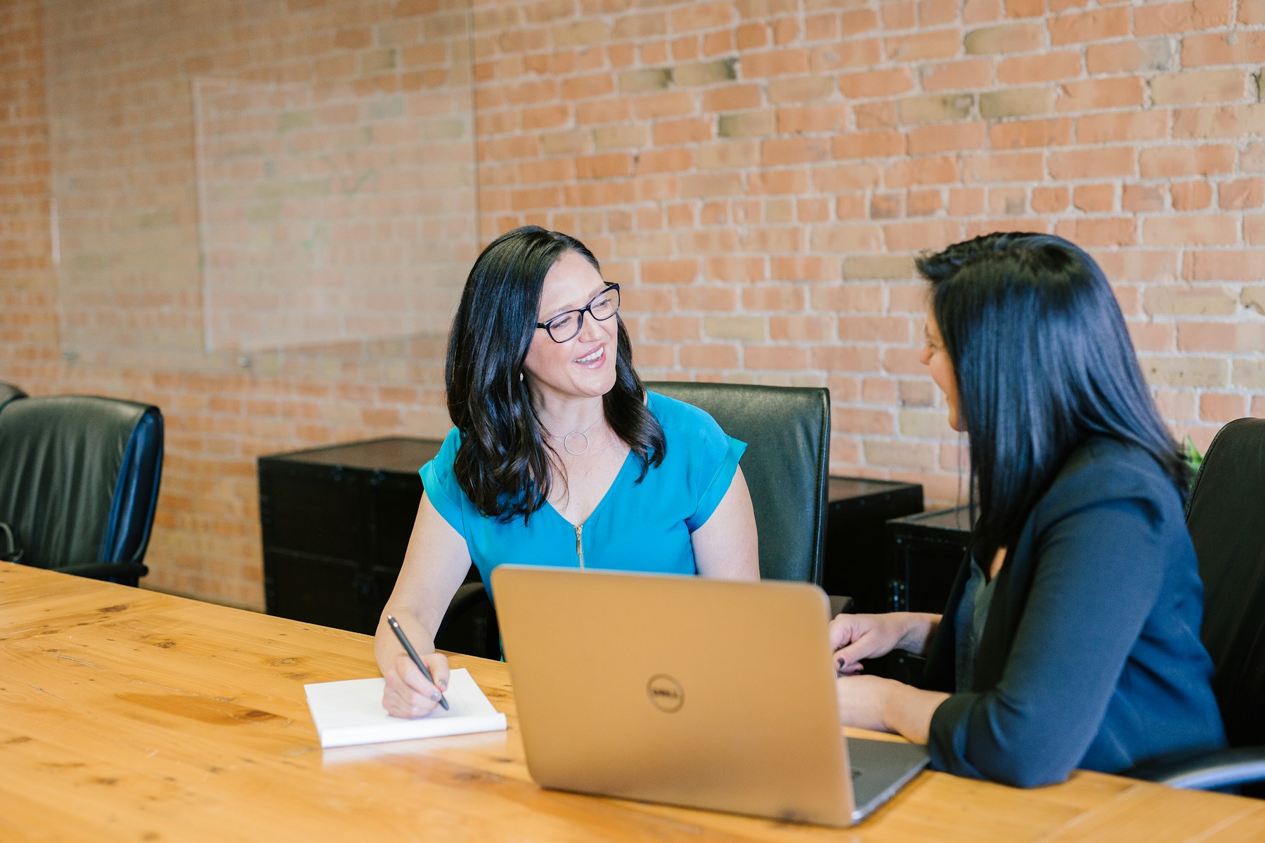 Small business team discussing CRM implementation and customer workflow